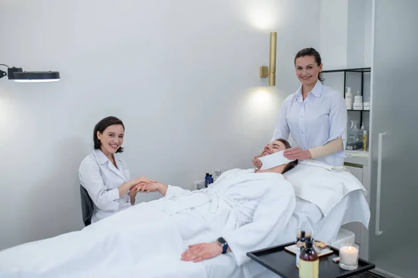 Skin Care Young Man Having Hand Massage Face Procedures Salon —  Fotos de Stock