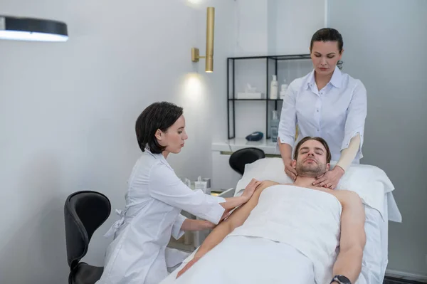 Skin Care Young Man Having Hand Massage Face Procedures Salon — Zdjęcie stockowe