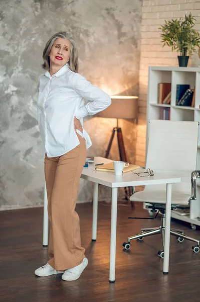 Feeling Bad Mature Woman Office Suffering Lower Back Pain — Stock fotografie