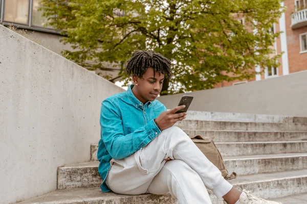 Interesting Information Dark Skinned Young Man Looking Intently Smartphone Screen — Stok Foto