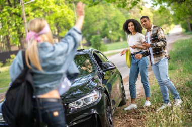 Adventure. Group of friends in the forest feeling joyful