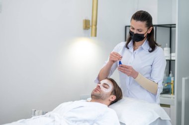 Beauty salon. Young man spending time in the beauty salon