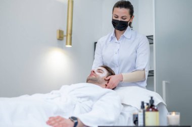Beauty salon. Young man spending time in the beauty salon