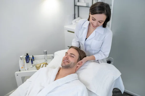 Face Care Dark Haired Professional Doing Face Massage Male Customer — Zdjęcie stockowe