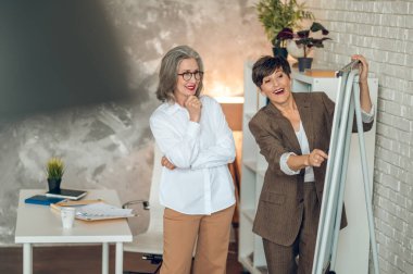 Interesting project. Colleagues discussing project details and looking involved