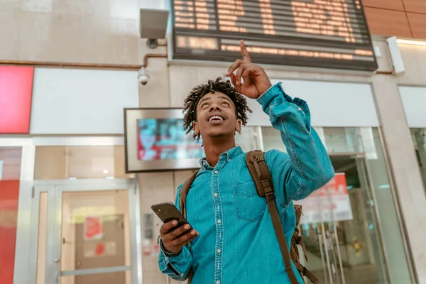 Attention Focused African American Guy Backpack Holding Smartphone Looking Pointing — Stok Foto