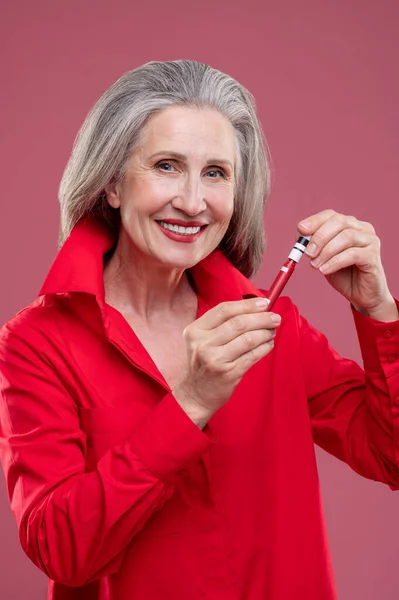 Lip Gloss Good Looking Mature Woman Red Putting Gloss Her — Stok fotoğraf