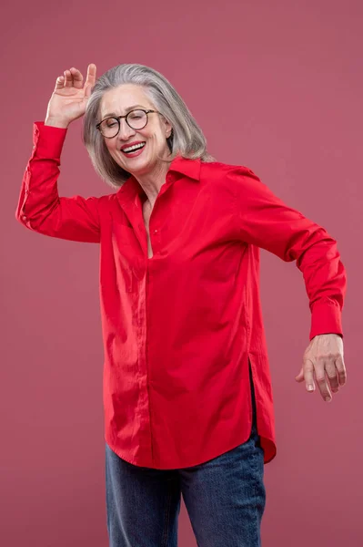 Energized Woman Red Shirt Moving Smiling — Foto Stock