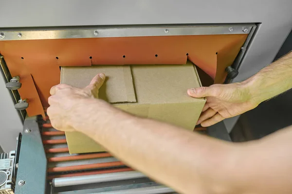 Cropped Photo Operator Hands Putting Cardboard Box Conveyor Rollers Carton — Foto de Stock