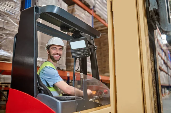 Smiling Cheerful Warehouse Worker Helmet Reflective Vest Sitting Forklift Cab — Stock Fotó