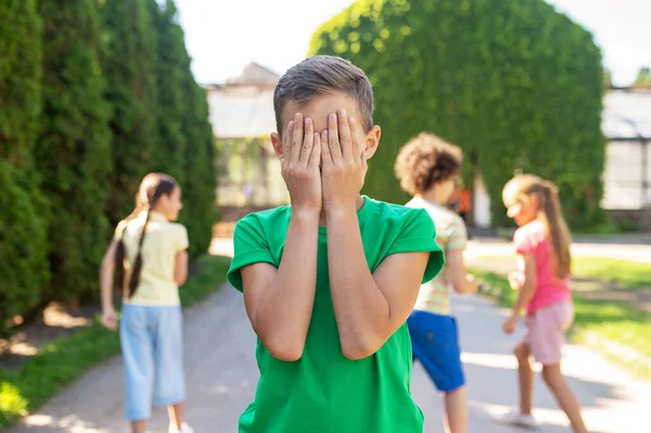 Hide Seek Boy Green Tshirt Covering Eyes Hands Hiding Children — Stockfoto