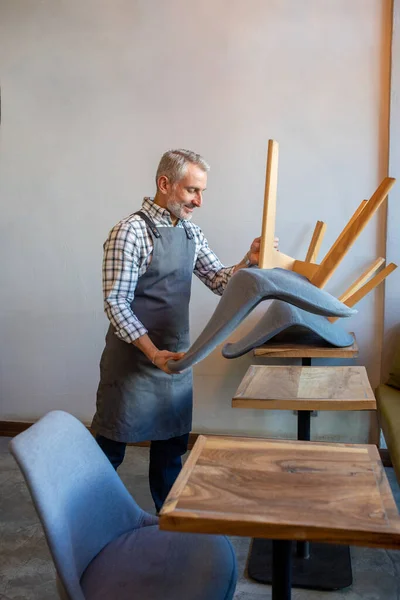 Cafe Man Apron Putting Chairs Table Cafe — Zdjęcie stockowe