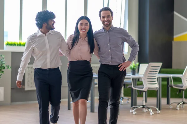 Dream team. Young business colleagues looking happy and cheerful in the office