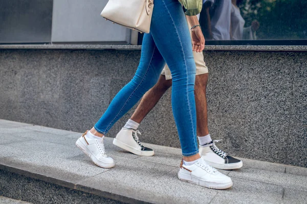 A walk together. Close up picture of a c couple walking in the street