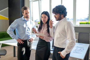 Good mood. Colleagues looking excited while discussing something