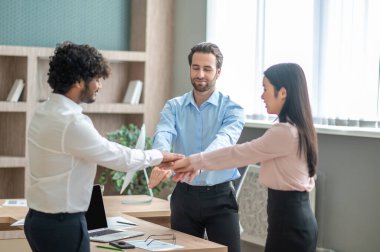 Good deal. Young business people looking excited and happy