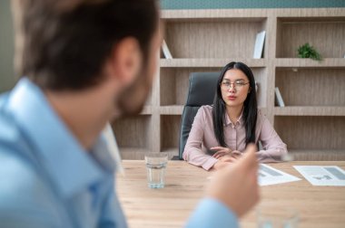 Work on project. Colleagues working in the office and discussing project details