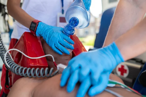 Cropped Photo Ambulance Doctors Sterile Gloves Performing Cardiac Massage Oxygenation Stock Photo