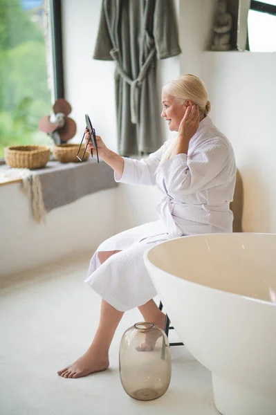 Side View Smiling Barefoot Female Dressed Terry Bathrobe Looking Herself — Stock Photo, Image