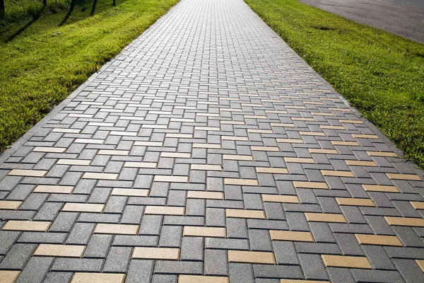 Sidewalk Made Rectangular Artificial Stone Extending Distance Yellow Gray Green Royalty Free Stock Images