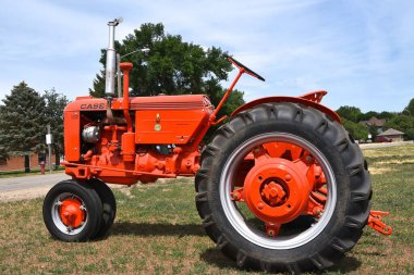 ESTELLEINE, SOUTH DAKOTA, June 25, 2021:  The side profile of the engine area of the orange tractor is a Case VAC, 2021. is a product now owned by J.I. Case International.