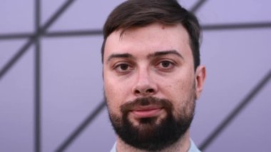 Positive man putting on glasses for vision concept of vision problem slow motion