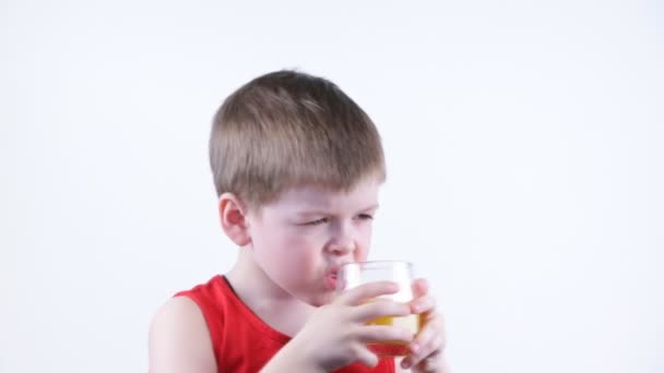 Boy drinking juice — Stock Video
