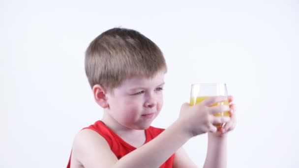 Boy drinking juice — Stock Video