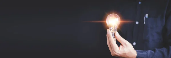 Idea Innovation Inspiration Concept Hand Man Holding Illuminated Light Bulb — Stok fotoğraf