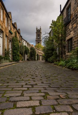 The beautiful picturesque cobbled street of Circus Lane, only a couple of minutes walk away from Edinburgh City center, Scotland clipart
