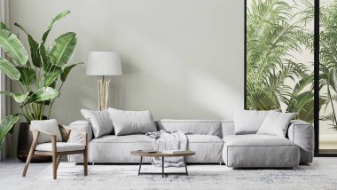 Gri kanepe, ahşap mobilya ve tropikal yapraklarla dolu modern oturma odası.