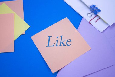 Like. Text on adhesive note paper. Event, celebration reminder message.
