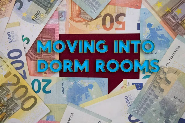 Moving Into Dorm Rooms word with money. Paper currency background with different banknotes.