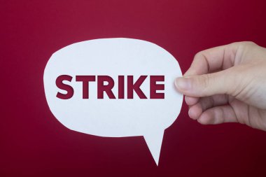 Speech bubble in front of colored background with Strike text.