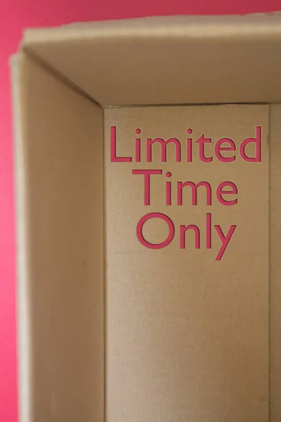 Limited Time Only word with cardboard box. Brown folded cardbox.