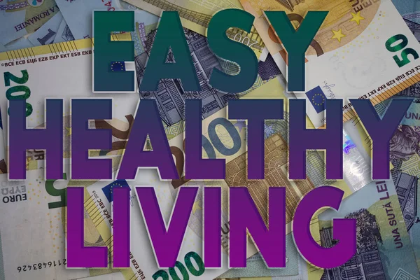Easy Healthy Living word with money. Paper currency background with different banknotes.
