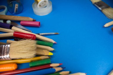 Overhead shot of school supplies, brushes, pencils, artistic tools. Art And Craft Work Tools.