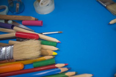 Overhead shot of school supplies, brushes, pencils, artistic tools. Art And Craft Work Tools.