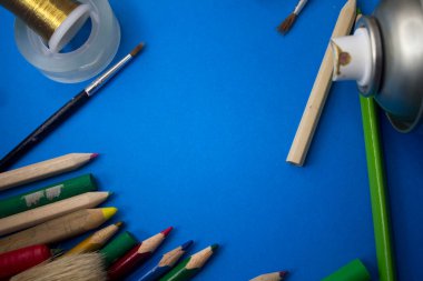 Overhead shot of school supplies, brushes, pencils, artistic tools. Art And Craft Work Tools.