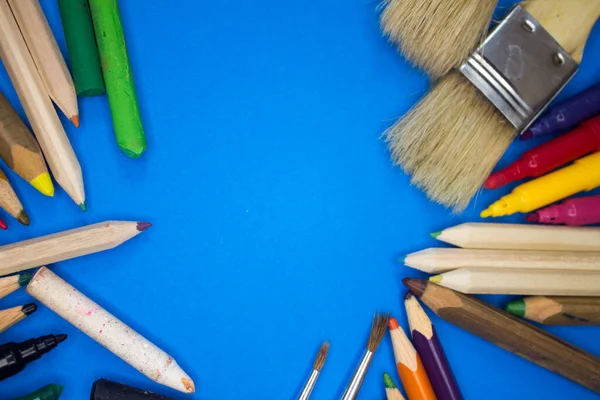 Overhead shot of school supplies, brushes, pencils, artistic tools. Art And Craft Work Tools.