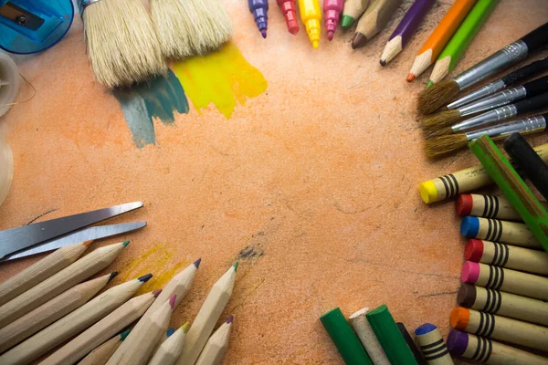 Overhead shot of school supplies, brushes, pencils, artistic tools. Art And Craft Work Tools.