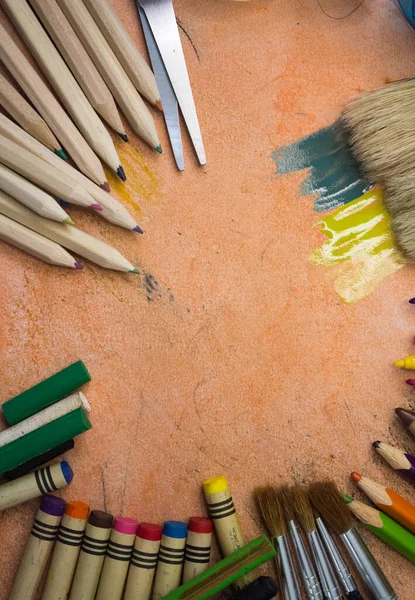 Overhead shot of school supplies, brushes, pencils, artistic tools. Art And Craft Work Tools.