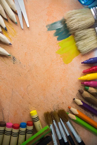 Overhead shot of school supplies, brushes, pencils, artistic tools. Art And Craft Work Tools.