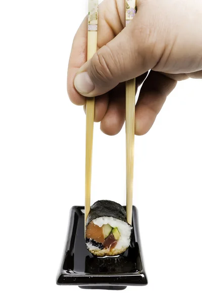 Dipping sushi in soya — Stock Photo, Image