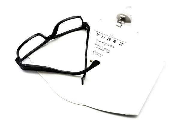 Gafas graduadas y carta ocular — Foto de Stock