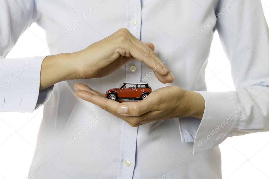 Hands holding a toy car