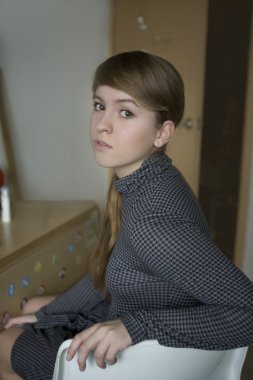 Portrait of young serious teen girl