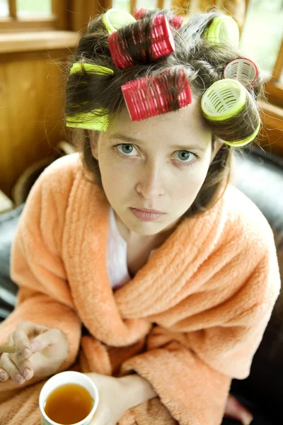 Young woman wearing gown drink tea — Stock Photo, Image