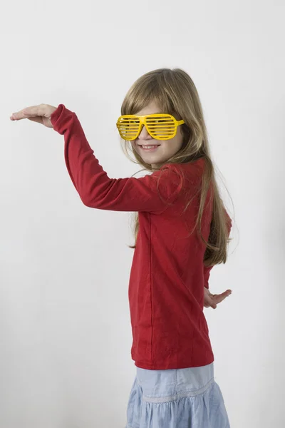 Girl in yellow sun glasses — Stock Photo, Image