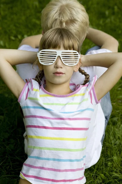 Brother and sister in strange sunglasses — Stock Photo, Image